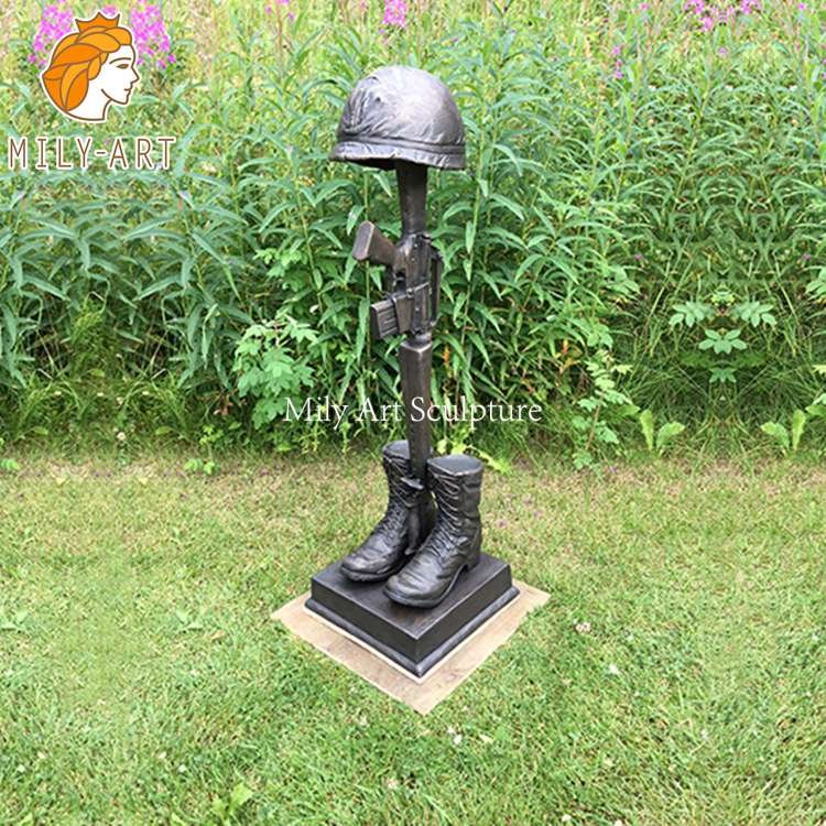 soldier kneeling at cross statue