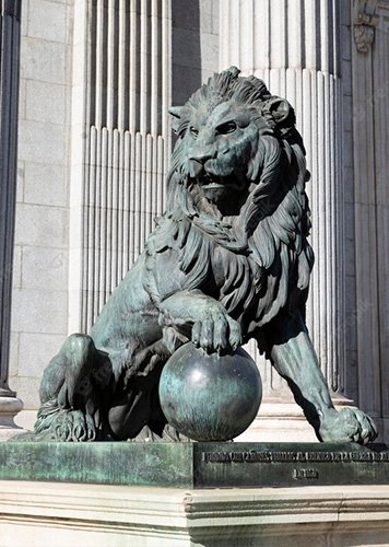 bronze lion with the ball