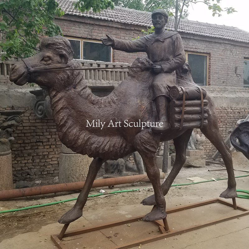 large bronze man riding camel sculpture mlbs 213