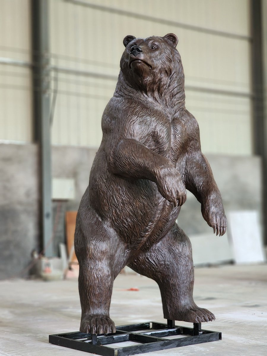 Large bronze bear sculpture with embedded iron frame