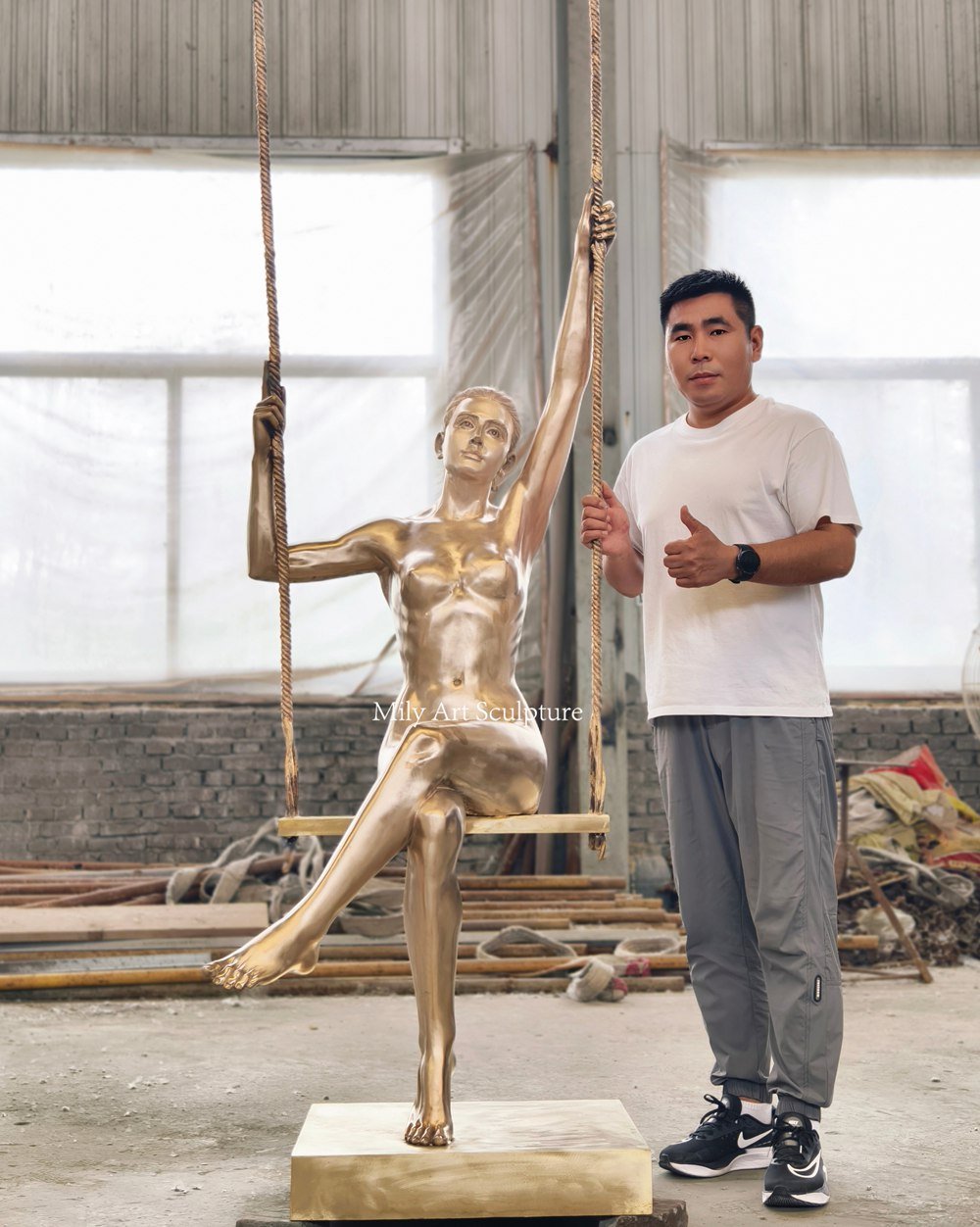 Polished Bronze Girl on a Swing Sculpture