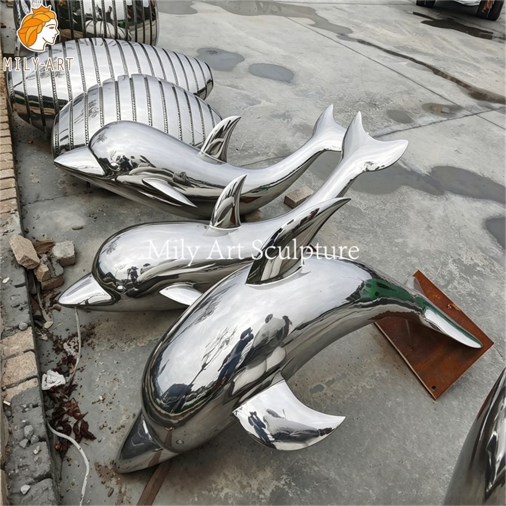 Group of mirror-polished stainless steel dolphin statues