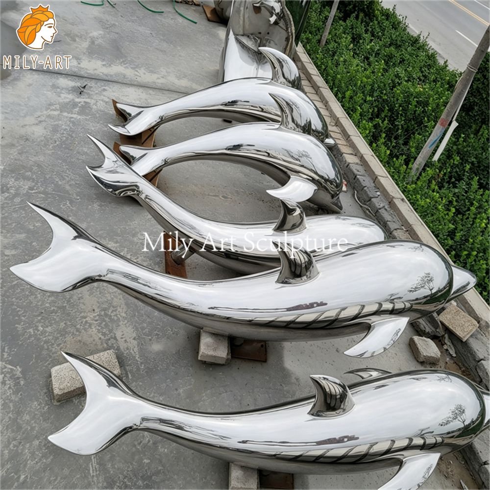 Group of mirror-polished stainless steel dolphin statues